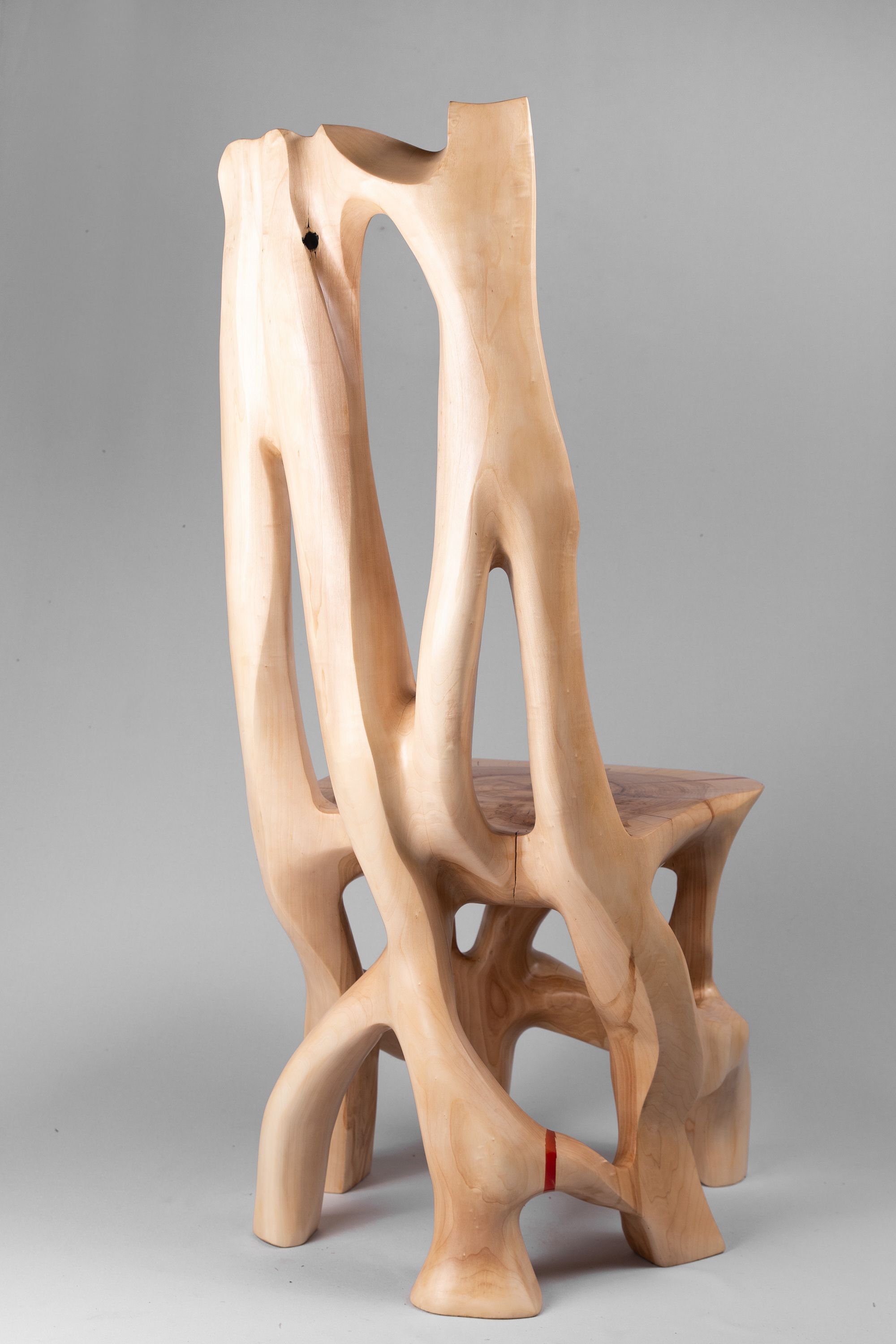 Hand-carved sculptural wooden chair
